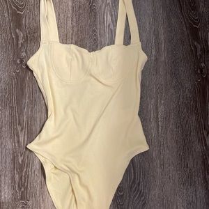 Yellow bodysuit never worn